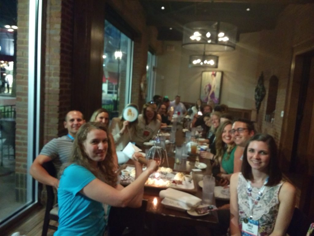#FinCon18 - Crowd gathered around the table for Stephonee's birthday