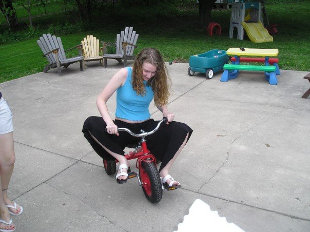 Stephonee in 2007, riding a child's tricycle