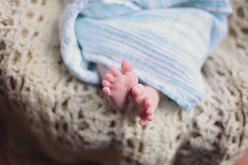 Newborn feet in receiving blanket